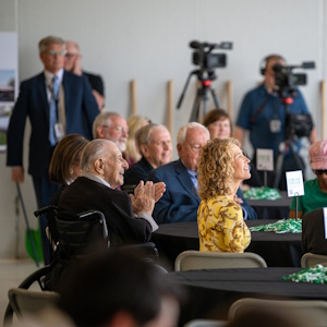 Attendees at the Flight Operations Center groundbreaking look on during the event