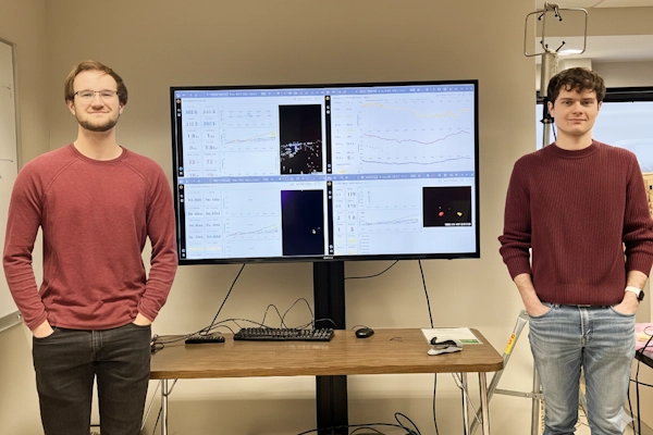 Students showcasing data graphs
